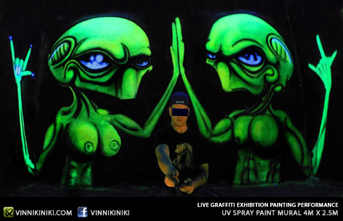 Black light alien graffiti art piece