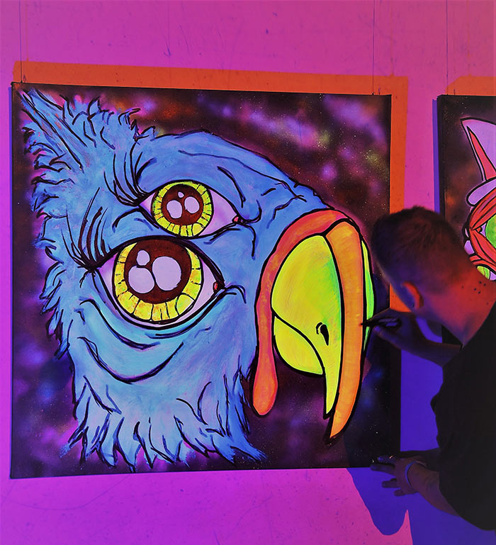 painting black light canvas at event