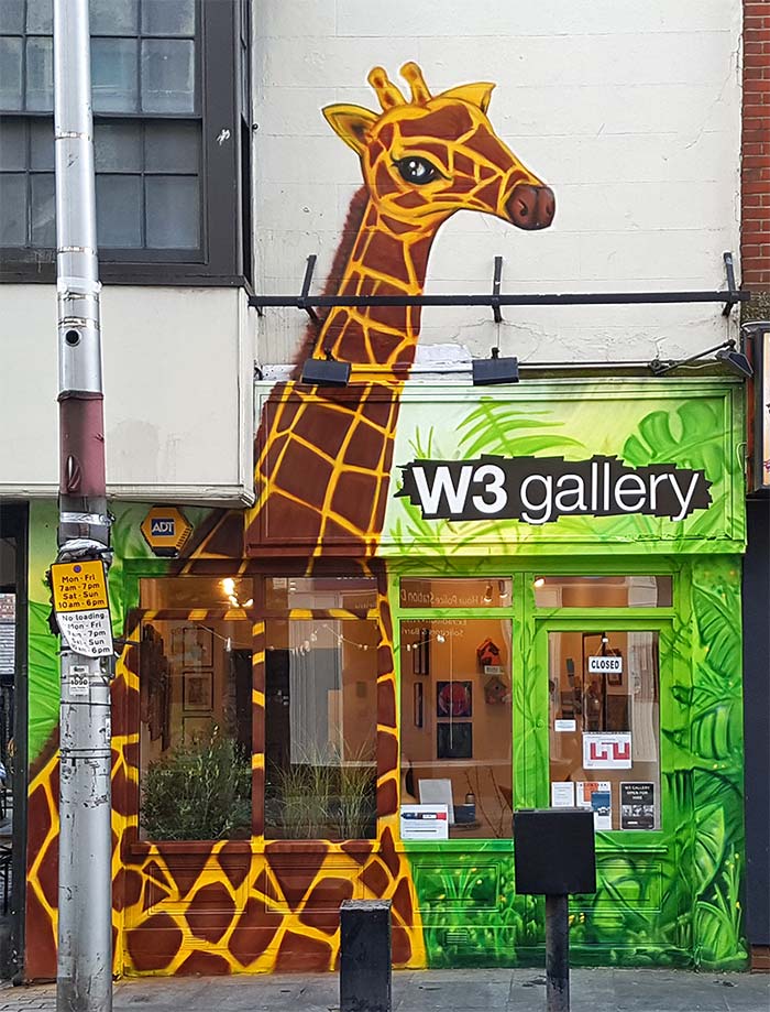 giraffe graffiti in the jungle mural