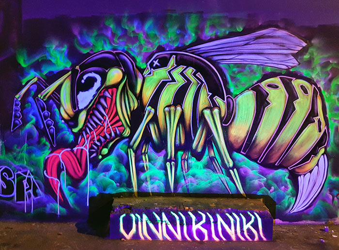 in the city,graffiti art with cool lighting ,universe full of