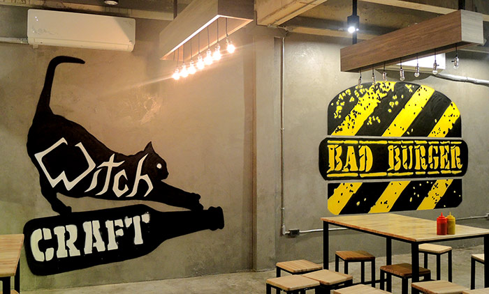 logo graffiti mural painted in craft beer and burger bar by vinnikiniki in bangkok