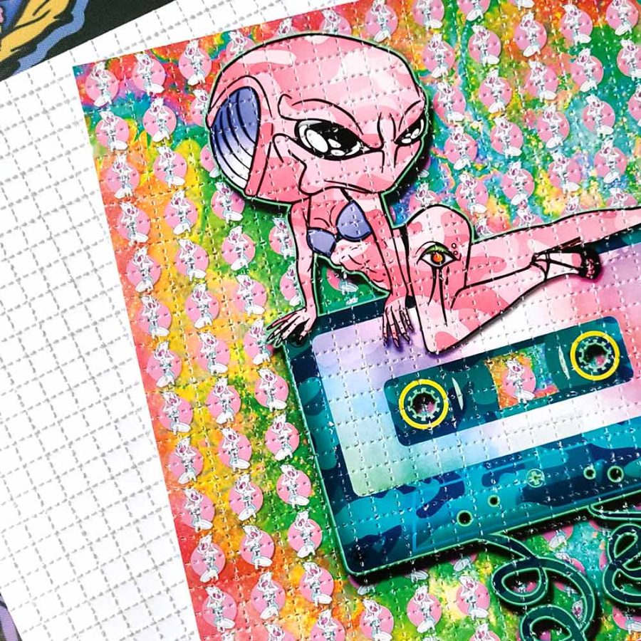 Close up photo of alien themed LSD blotter art to buy on Printdub