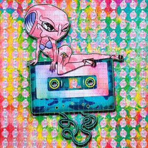 photo of lsd blotter acid art print featuring psychedelic rainbow colours and an alien posing on top of a audio cassette tape trippy gift