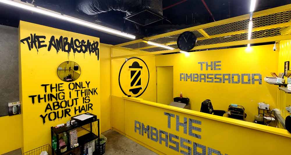 The Ambassador Barbershop, Bangkok by artist Vinni Kiniki urban lettering graffiti mural photos stencil style logo interior