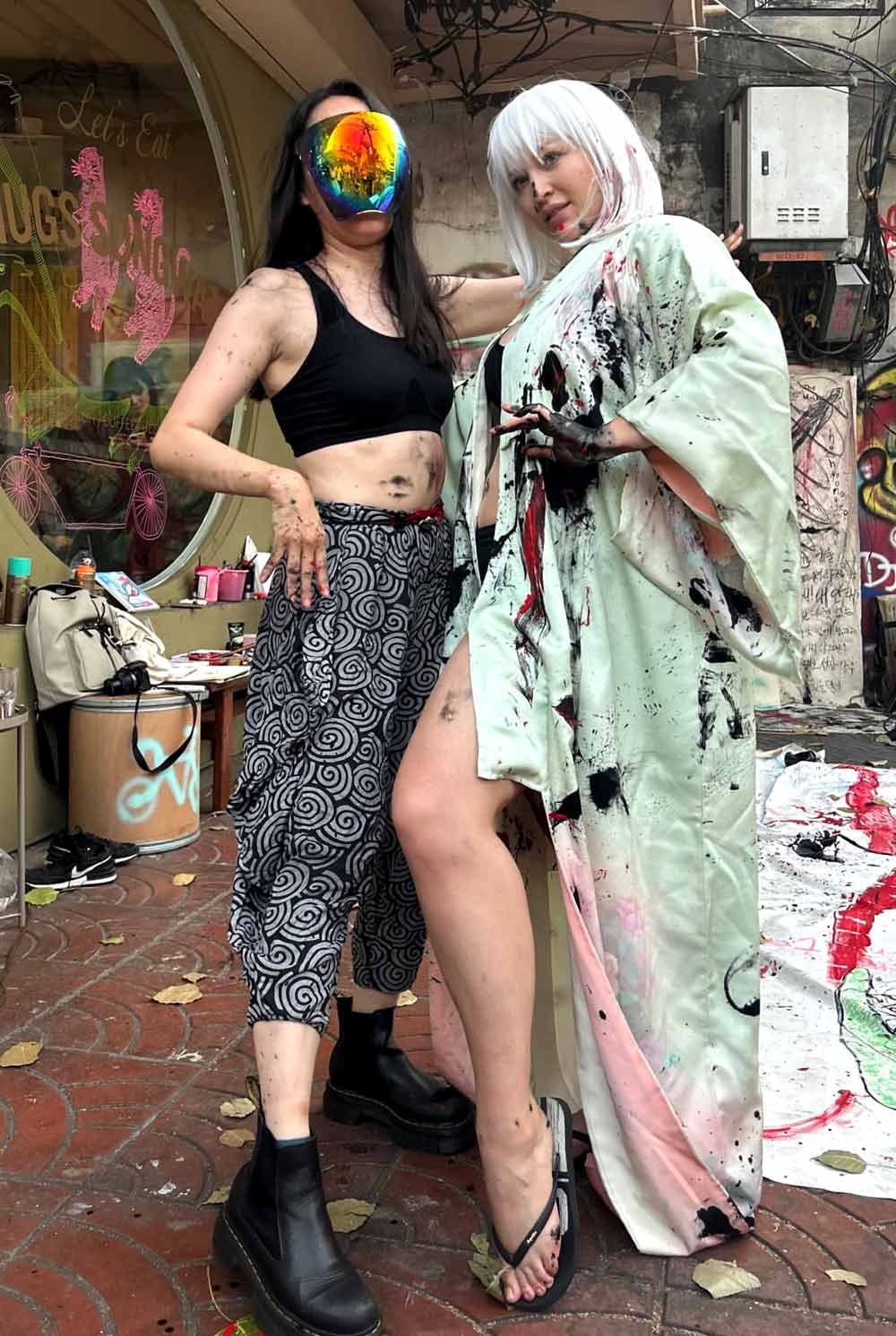Artists Maiko Uwabami and @ita_away_today post performance mode in Bangkok