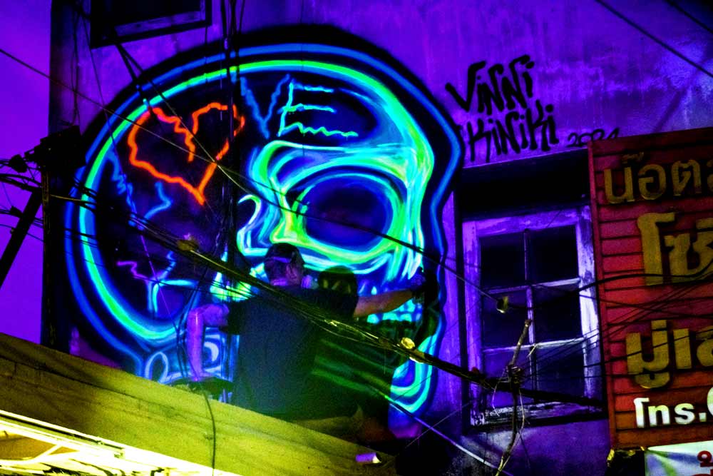 live event Black light graffiti painting by Vinni Kiniki for the The Hechyeomoyeo closing party at Hugs Songwat in Bangkok Thailand