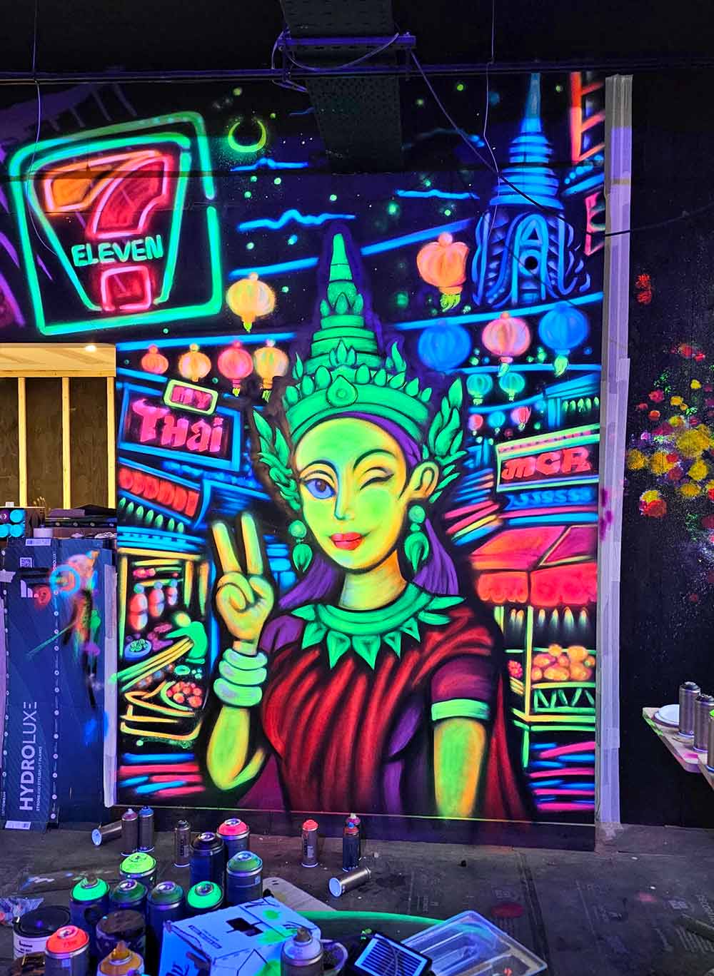 Neon Bangkok street scene with Thai woman Black Light graffiti mural at My Thai Manchester by artist ViNNi KiNiKi