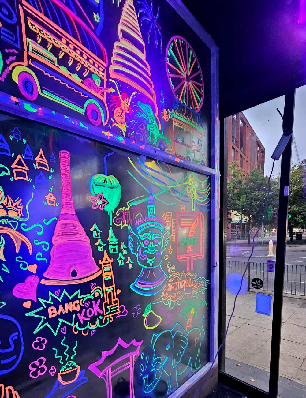 Neon glass art entrance using black light reactive inks and paint pens at My Thai Manchester by Vinni Kiniki 