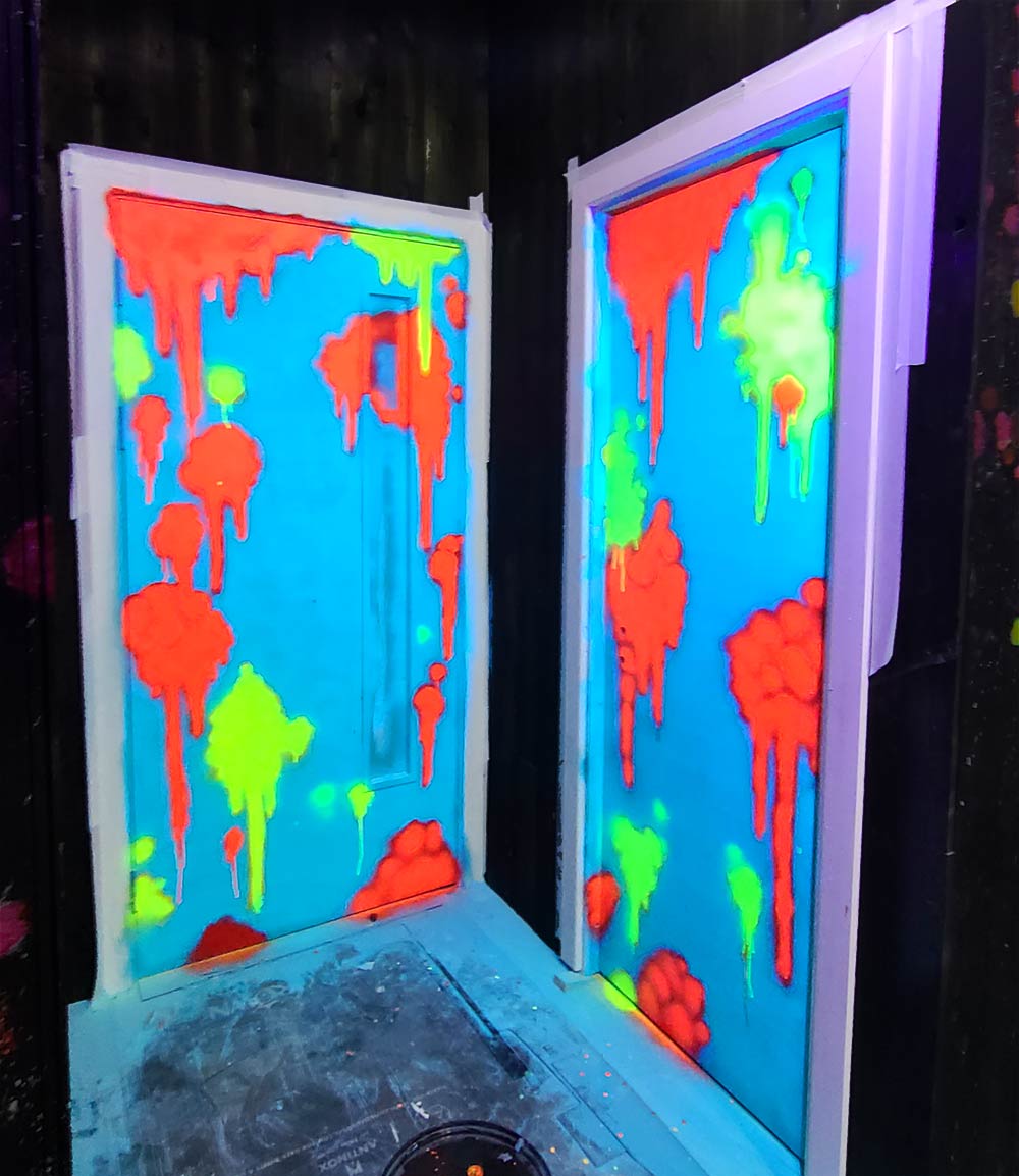 UV reactive graffiti pop art murals on toilet doors at My Thai restaurant in Manchester neon background layer WIP