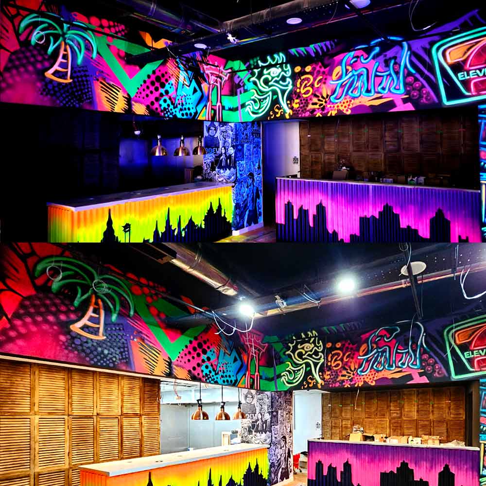7m x 1.5m UV reactive black light graffiti mural in abstract pop art style at Thai restaurant, featuring mock neon paintings of elephant, Giant Swing, naga serpent, and coconut tree by artist ViNNi KiNiKi at My Thai restaurant in Manchester Piccadilly