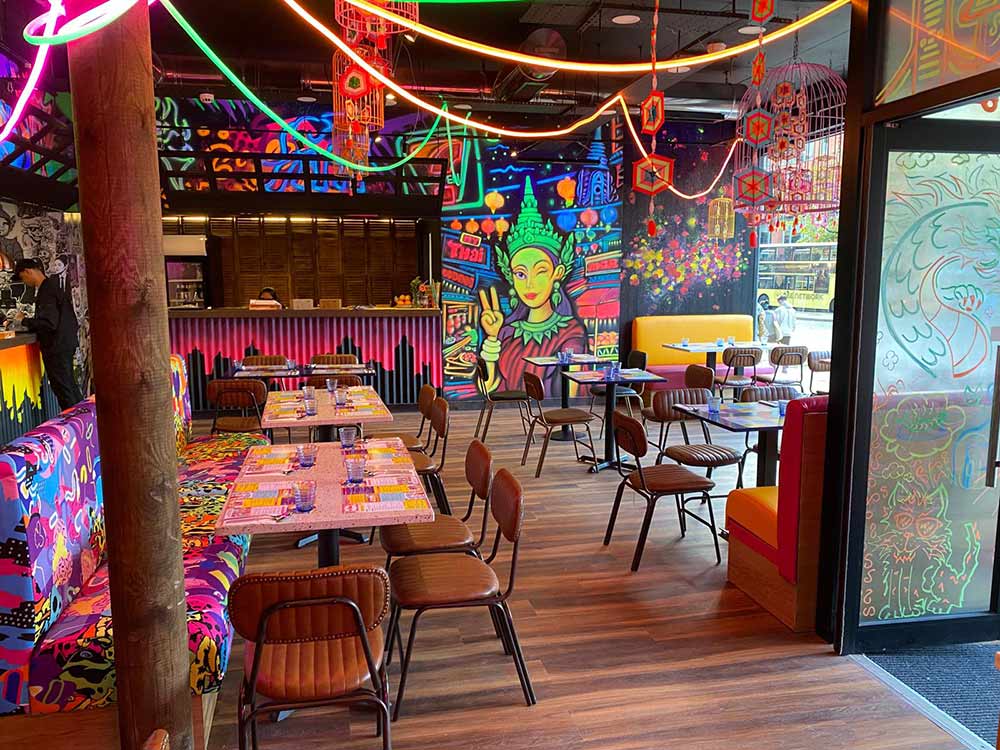 Black light pop art graffiti wall painting at My Thai Restaurant Manchester