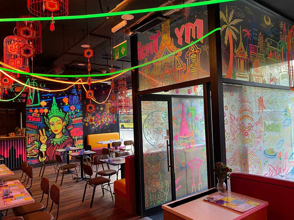 Street art and vibrant black light interior murals for My Thai Restaurant in Manchester