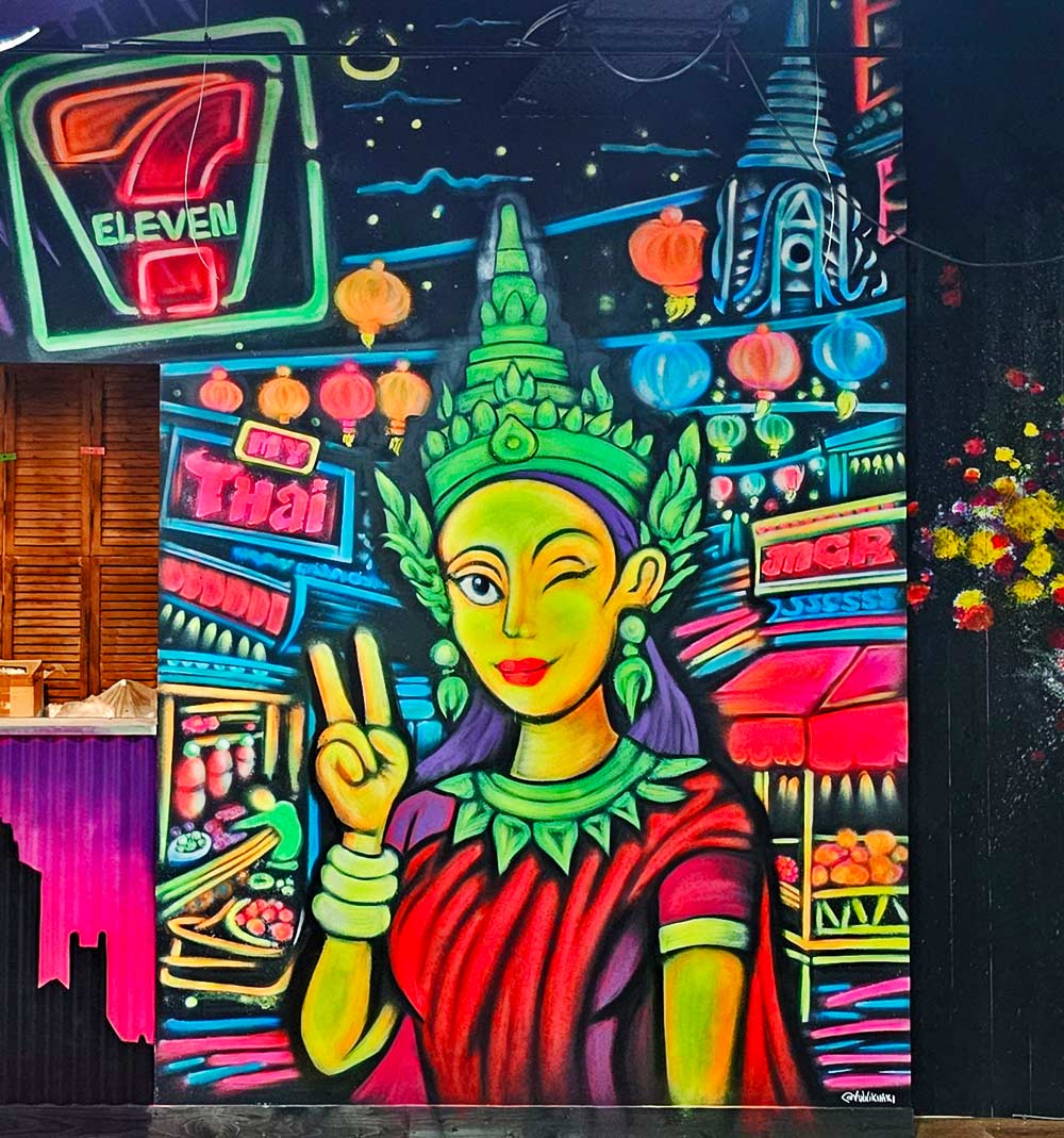 Black Light graffiti mural at My Thai Manchester neon Bangkok street scene with Thai lady artist ViNNi KiNiKi